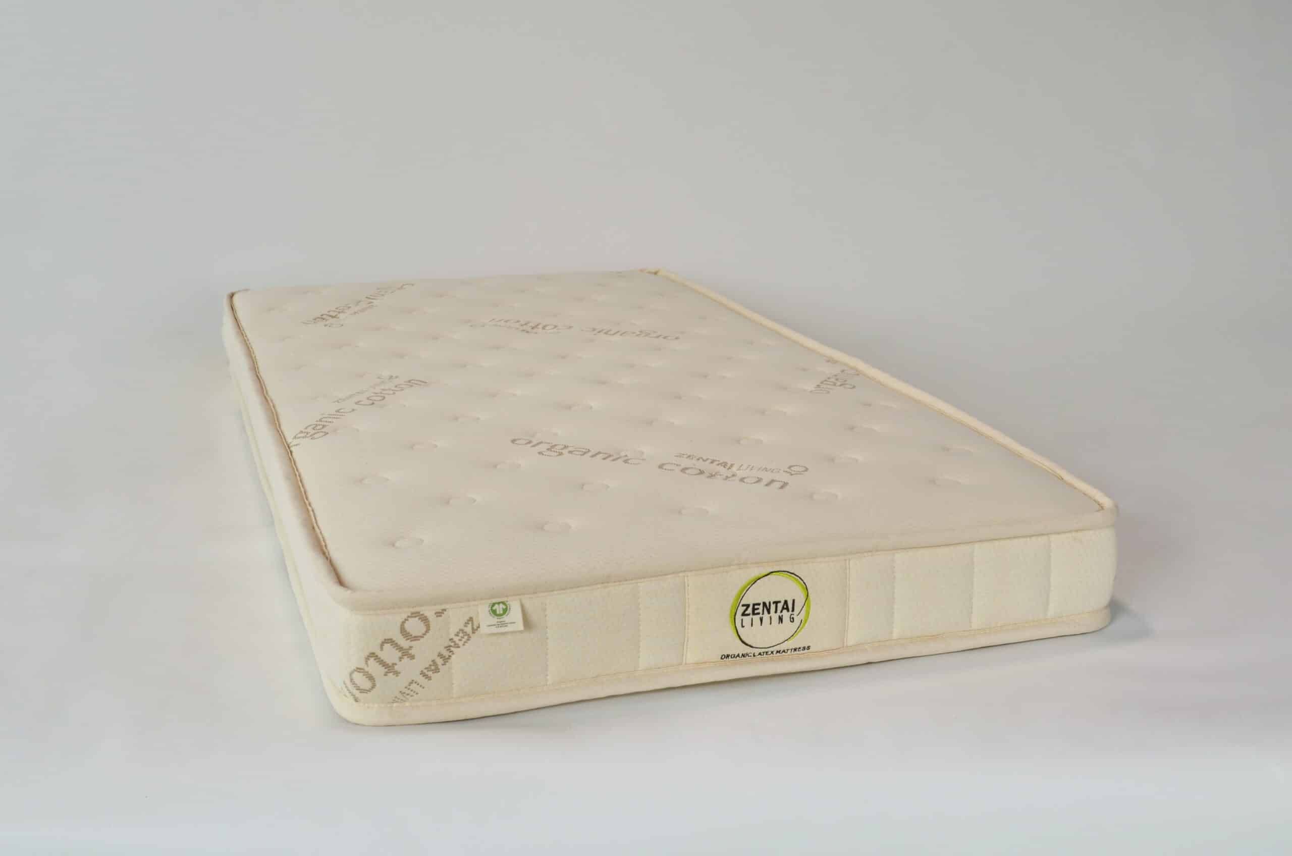 Quilted organic cotton cot mattress, angled view